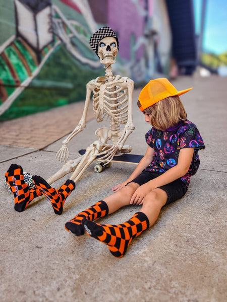 Orange & Black Checkered Kids Socks - Ledger Nash Co - Model 1