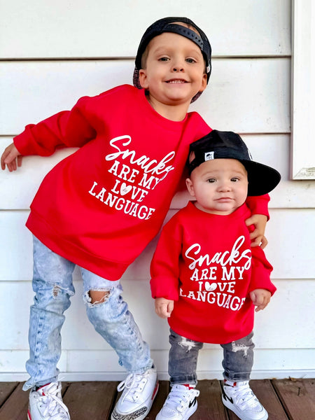 Snacks are my love language kids valentine's day crewneck sweatshirt - Ledger Nash Co - Model 1